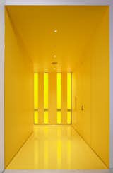 The yellow hall gives a bolt of energy as you head into to the lecture hall. © Greg Irikura 2013.