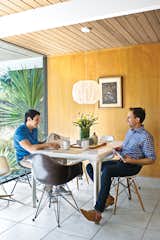 The couple’s vintage Stadio dining table is by Vico Magistretti for Artemide; the Eames chairs came from an old school in Palm Springs.