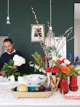 Ever the arranger, Aumas makes another vignette in the kitchen amid vintage vases and bowls.