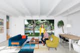 Living Room, Sofa, Coffee Tables, and Pendant Lighting Glee star Jayma Mays and actor Adam Campbell in the living room of their Los Angeles home.  Photo 2 of 13 in The Modern Renovated Home of Glee Star Jayma Mays