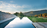 Bernard Trainor collaborated with architect Peter Bohlin for a pool design in the Santa Lucia Preserve. Photo by: Jason Liske. Published in the April 2013 issue of Dwell.  Photo 11 of 27 in Pools to Dive Into by Kate Gregory from Landscape Architect Bernard Trainor