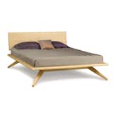 Copeland’s Astrid Beds take an elegant platform shape and lift it from the floor with four deeply splayed legs that produce dramatic cantilevers. The result is a silhouette that is at once simple and engaging, that connects with traditional platform shapes while innovating the form with thoughtful detail. As a true platform bed, the Astrid can be used in small bedrooms and large bedrooms alike, making it a versatile sleeping option. Patiently crafted from solid hardwood, the Astrid bed is an heirloom-quality furnishing that features a rich wood grain and warm aesthetic.