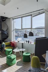 Design duo Morten & Jonas find inspiration from their view of a fjord in Bergen, Norway. The colors and curves in their office belie their playful style, exhibited in creations such as the Wobbelhead Lamp.  Photo 7 of 9 in These Studios of Scandinavian Designers Are Bursting with Creativity by Patrick Sisson