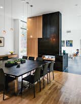 Large family gatherings are common so the dining table by Moon Custom Millwork comfortably seats 12; it’s made from wood that resident Sam Chung salvaged himself.