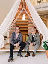 Alex and Manuel Alorda recline in a canopy designed by Patricia Urquiola in 2009.  Search “new patricia urquiola” from A Family-Run Company Gracefully Shifts from Aluminum Folding Chairs to High-End Outdoor Furniture