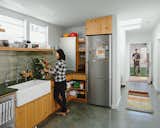 Kitchen, Ceramic Tile Backsplashe, and Refrigerator The kitchen features custom casework by Peter Doolittle, dark-green slate countertops from Hamilton-Schwarzhoff, and a Heath Ceramics backsplash.  Search “backsplash” from Abandoned Industrial Compound Becomes a Modern Home Base