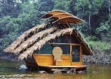 The floating room emulates local huts with its steep thatched roof that easily sheds the region’s punishing rains.