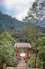 In 2001, Price and his students built a meditation structure at the end of a cantilevered walkway that extends off the end of a cliff in Nepal.