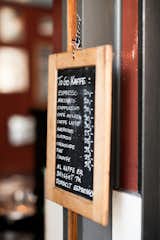 The café's blackboard menu lists many global favorites such as an espresso, Americano, and iced coffee. Apparently some of the best coffee around is brewed here. Hotel guests are treated to a complimentary organic breakfast. Photo by: Martin Kaufmann