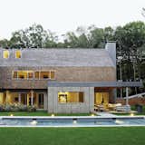 Inspired by their clients’ bold art collection, a pair of architects designed a mix influenced Hamptons vacation house that subverts tradition.