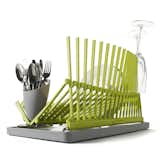The lime green sculpturally-shaped dish rack is both contemproary and highly functional dishrack inspired by architecture-its shape folds down to a flat cmpact shape for easy storage, wave of spikes can be used to hold all your serving ware goods, and there's even a drainage tray with an ingenious flip so that you can choose to drain or not, depending on the dishrack's placement.