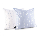 Inhabit's Pussy Willow pillows in ice have a basic, stylish pattern and contrast well with the somber gray and brown tones. From $45