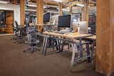 The table in situ at GitHub's San Francisco headquarters. Other companies that have incorporated MASHstudios’ contract pieces into their offices include Google, Twitter, and most recently, Uber.  Photo 6 of 9 in Office by Mechi from MASHstudios Height-Adjustable Work Table