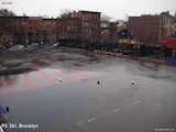 The asphalt at this school playground in Brooklyn caused stormwater to drain into the Gowanus Canal, putting pressure on the city's sewer system, and adding contaminated runoff to an already polluted waterway. It also made a drab addition to the cityscape.