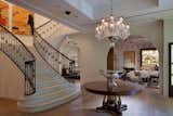 The mansion entry hall includes a large staircase that allows the customer to meander through multiple floors.