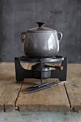"The company Le Cousances, founded in 1553, was acquired by Le Creuset in 1957. This beautiful grey Le Cousances fondue set is immaculate and precious. It's perfect for a honeymoon in Alaska."