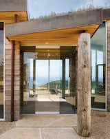 With floor-to ceiling windows, this  1,900-square-foot home located in Big Sur, California, has striking and expansive views of the Pacific Ocean. Photo by: Robert Canfield  Photo 5 of 8 in Green Beach Getaways by Andrea Smith from A Look at Waterfront Homes