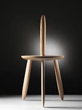 Avant-garde Dutch designer Aldo Bakker's 3dwn1up chair is built from five pieces of wood: one seat and four "legs," one of which functions as a backrest.
