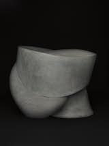 Three Pair is crafted from three abstract stone components that form a stool.