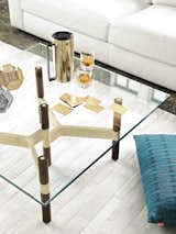 The Helix Table by Chris Hardy for DWR is a perfect triumvirate of glass, wood, and brass.
