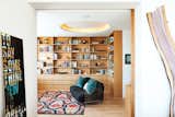 Living Room, Sofa, Rug Floor, Light Hardwood Floor, and Ceiling Lighting Located in West Village, designer Suchi Reddy constructs a modern family-friendly apartment.  Search “3 innovative outdoor libraries russia” from A Look Into 5 New York Apartments
