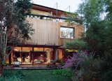 Buenos Aires furniture designer and architect, Alejandro Sticotti renovated his Argentinean home applying and installing reclaimed wood to the floors and walls to create a peaceful setting. Photos by: Cristóbal Palma