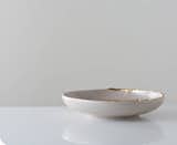 Flawed Gold-Plated Wide Bowl Studiomake’s Flawed dinnerware series features imperfect gilded rims that references the traditional craftsmanship of Thailand, where Studiomake is based. $68