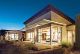 Exterior, House Building Type, and Stucco Siding Material Because the night air cools the walls in summer, the home has no air-conditioning—though daily highs often rise into the mid-90s and above. Photo by: Kirk Gittings  Photo 4 of 5 in A Sustainable Rammed Earth Home in New Mexico