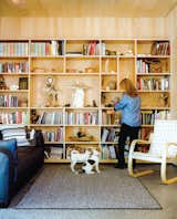 Living Room, Chair, Bookcase, Rug Floor, and Terrazzo Floor Architects Mayer Sattler-Smith designed the bookshelves and Alvar Aalto the 406 lounge chair for Artek.  Photo 3 of 7 in Photographer Q&A: Kamil Bialous from This Modern Cabin Is the Ideal HQ For a Family in Alaska