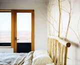 Buser designed and made the headboard in the master bedroom from local aspens.