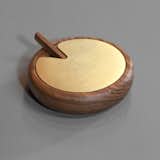 Isabella Furniture's turned salt cellar with a solid brass top and wooden spoon is a throwback to an earlier era of dining at home. ($95) A smaller vessel also goes for $95.