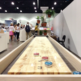 Fancy a game of shuffleboard? Head over to the @dwell_store's booth at #Dwellondesign and try your hand.