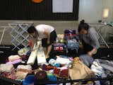 Aguiñiga’s fellow artists prepare the crocheted blankets sent in by knitters from all over the country.