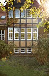 Exterior, House Building Type, and Gable RoofLine Original windows with weatherstripping, when well-maintained, can often be as energy-efficient as new double-glazed windows.  Photo 11 of 12 in A Cramped Attic Became a Sunny Dining Room in this Renovation of a Copenhagen Tudor