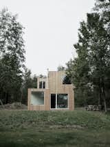 In Hungen, a lakeside town, regulations require homes to occupy a footprint of no more than 538 square feet, and be only one story tall. NKBAK worked around these limitations by designing a modern home with only a partial second story.