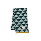 The beauty of this geometrically-inclined cotton throw from Ferm Living is that its triangular pattern will complement a solid-colored couch or give a busier print even more visual intrigue (not to mention keep you warm under cover).  Photo 3 of 5 in Modern and Bright Blankets by Jaime Gillin