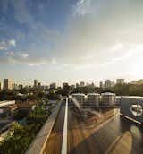 The roof deck of Kogan's Cube House offers a spectacular view of the sun.  Photo 9 of 10 in City Homes with Astounding Views by Luke Hopping from Urban Rooftops Made For Lounging