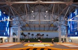 San Francisco Marathon Mile 5 - Course 2022 Landmark - The U.S. Army’s former airplane hangars on Crissy Field posed a complex rehabilitation challenge for the Presidio Trust. Fortunately, the House of Air, a trampoline gymnasium, offered a new use that capitalized on this hangar’s large, open interior, steel trusses and slightly gritty character. New components were skillfully placed within the cavernous structure, with the architect riffing on its aviation history to produce a bright, playful interior where people can literally take flight. Photo by: Ethan Kaplan.Original builder: U.S. Army (1921) Contemporary architect: Mark Horton Architects (2011) Photo 6 of 7 in 7 Architectural Preservation Projects in San Francisco
