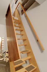 There was no room in the 2,000-square-foot house for a staircase to a new upstairs office, so the Imhoffs installed a small, wooden alternating-tred lapeyre stair.  Photo 7 of 7 in Transformative House Renovation in Seattle