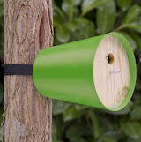 The aluminum housing protects birds year-round and attaches to trees with a fastener and lashing strap that does no damage to the tree.