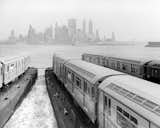 Here, new subway cars are being transported by barge to New York City.