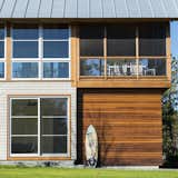 White and red cedar boards—also typical Cape Cod materials—clad the exterior.