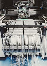 Over the years, McIntosh has added computer-controlled machines to its assembly line, like this one, which churns out about 5,000 circuit boards per month.