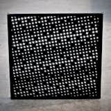 The houndstooth in the Houndstooth Valet comes in the perforations of the acrylic panels. It's a nice nod to menswear while also lightening up what could be a flat black surface.