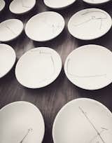 Cadena designed all the dishes, covering them with abstract, hand-drawn patterns inspired by his grandma's silverware.
