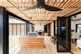 Multiple types of wood come together at this indoor/outdoor porch.