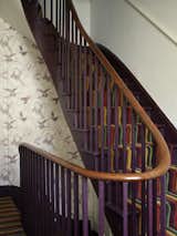 A new, wider staircase replaced the original Victorian version, and links the public and living areas; and the kitchen and the subterranean basement office.

Much of the salvaged materials in the house came from the National Museum of Scotland, and their zoological origins have been picked up in the wallpaper created by Danile Heath, which features drawings of birds being stuffed for display.  Photo 5 of 12 in A Gracious London Terrace House Is Reborn with Salvaged Materials
