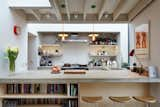 Kitchen, Concrete Counter, and Subway Tile Backsplashe “The client wanted an interior space where you could read the materiality of the building elements like understanding the ingredients in a recipe,” principal architect Elizabeth Webster explains. The extension features distinctly textured materials: an exposed timber ceiling, painted brick walls, and polished concrete floors. Warm lighting by Brinklicht unifies the space.  Search “smart designs small kitchens” from House of the Week: Modern Kitchen with a Striking Skylight