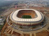 Soccer City Stadium (Johannesburg, South Africa: 2010 World Cup)

The “African Pot,” site of many vuvuzelas and victories during the 2010 contest, was designed to resemble the calabash, a curved gourd that was one of the earliest cultivated plants. At night, lights highlight a ring of tan, crimson, and clay colored tiles wrapped around the exterior.   

Photo by shanediaz120, Creative Commons  Search “contests” from Well-Designed World Cup Stadiums  