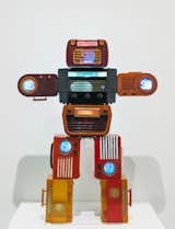 Bakelite Robot (2002) is a robotic sculpture made of stacked, vintage Bakelite radios inlaid with television screens.